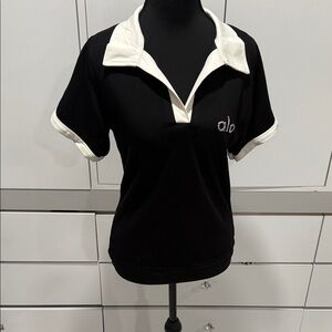 ALO Yoga Women's Black and Cream Short Sleeve Polo